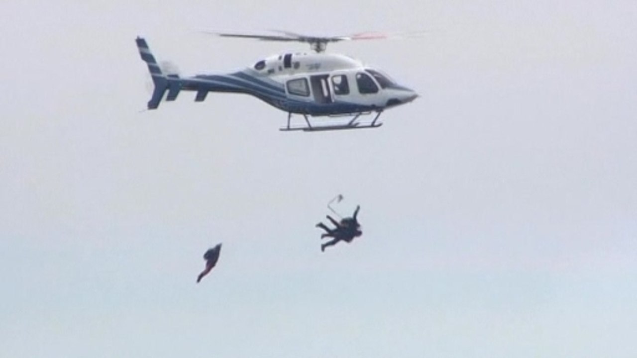 Former U.S. President George H.W. Bush skydives for 90th birthday