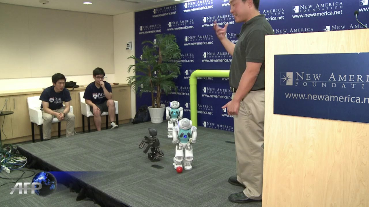 US students show off robots playing football