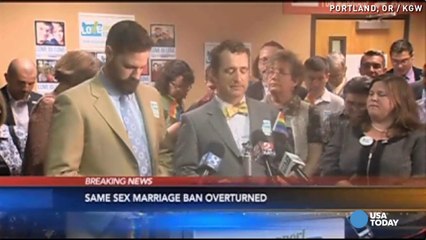Gay couples celebrate after ruling on Oregon ban