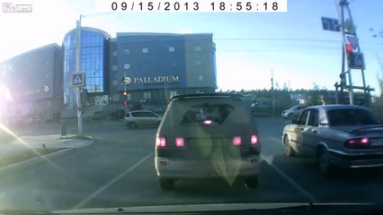 Car crashes into crossing light pole and the sparks fly