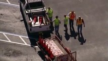 Raw: Sinkhole collapses Fla. parking lot