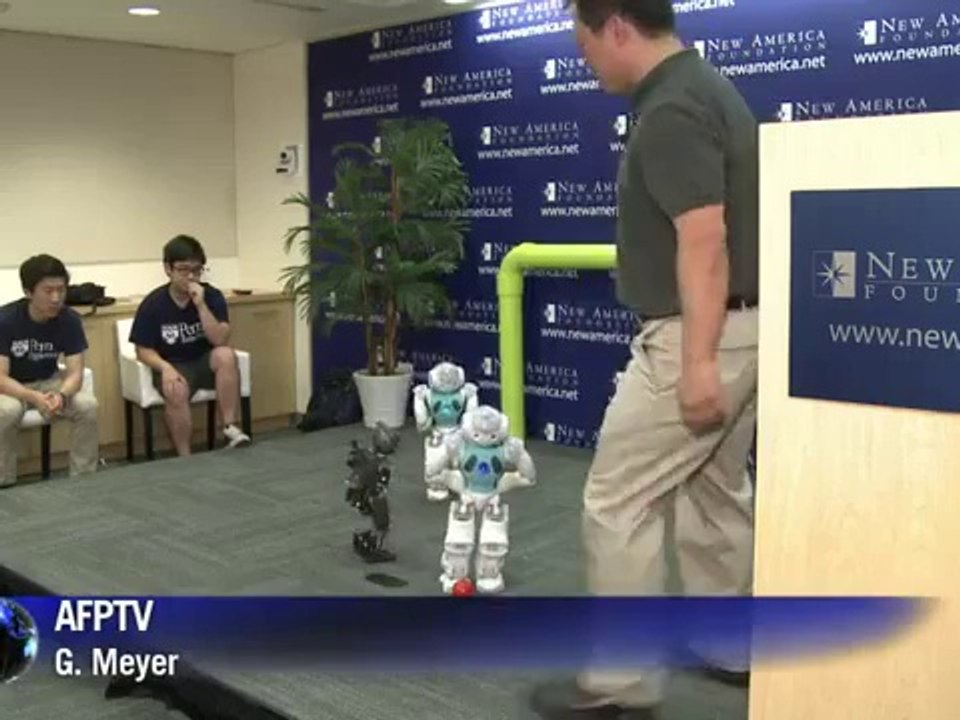 US students show off robots playing soccer