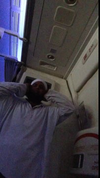 Muslim praying during flight... A little noisy!