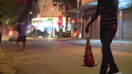 Gun-wielding man takes on Rio protesters
