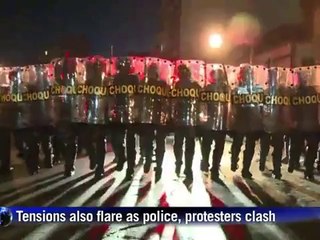 Gun-wielding man takes on Rio protesters