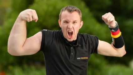 German Wrestler Sports One Giant Popeye Arm