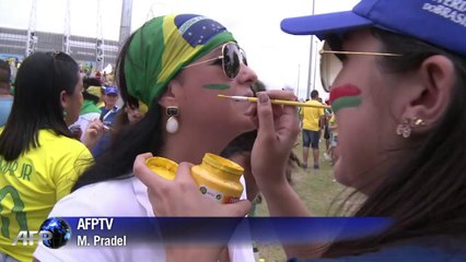 Mexico and Brazil fans cozy up to each other at match