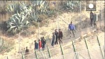 Hundreds of migrants try to jump the fences a Spain's enclave border but are turned back