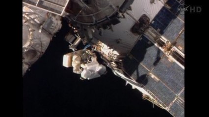 Cosmonauts install antenna at International Space Station