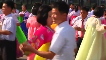 North Korean youths dance in tribute to late leader Kim Jong-il
