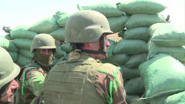 Kurdish Peshmerga forces battle insurgents on the frontline
