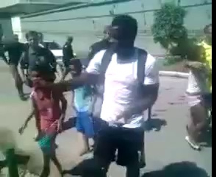 Ghana star Sulley Muntari handed out money to poor Brazilians in the city of Maceio