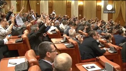 Romania's president urged to quit after brother held on bribery charges