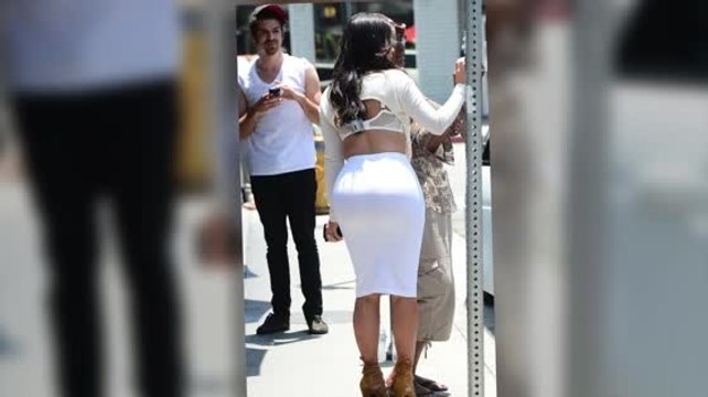 Kim Kardashian Flashes her Bra