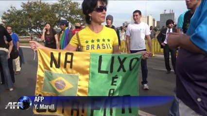 Protesters burn mock World Cup trophy in Brasilia