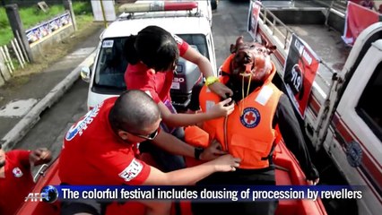 Roasted pigs parade in Filipino village for religious fest