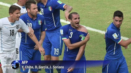 Uruguay's Luis Suarez risks World Cup ban after Italy bite