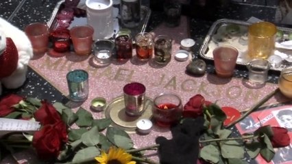 Fans adorn Michael Jackson's Hollywood star, five years on