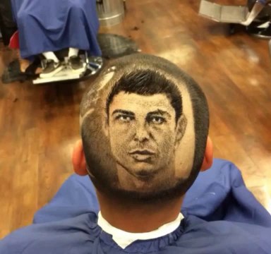 Barber extraordinaire 'Rob the Original' shaves Cristiano Ronaldo into a fan's head