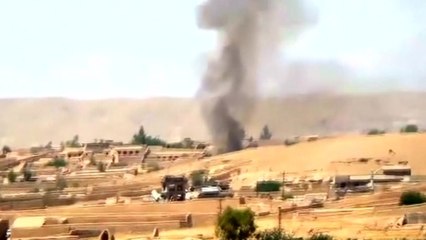 Taliban battle Afghan forces for control of southern district