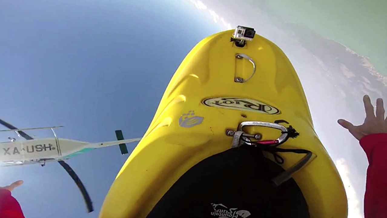 Miles Daisher Jumps From A Helicopter At 11,000 Feet, Wearing A Kayak