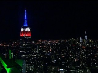 Raw: Empire State lit up red, white and blue