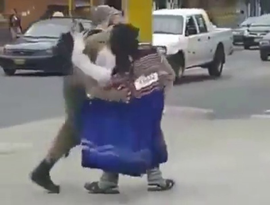 So funny guy dancing with a fake girl in the street. Amazing and hilarious street performer!