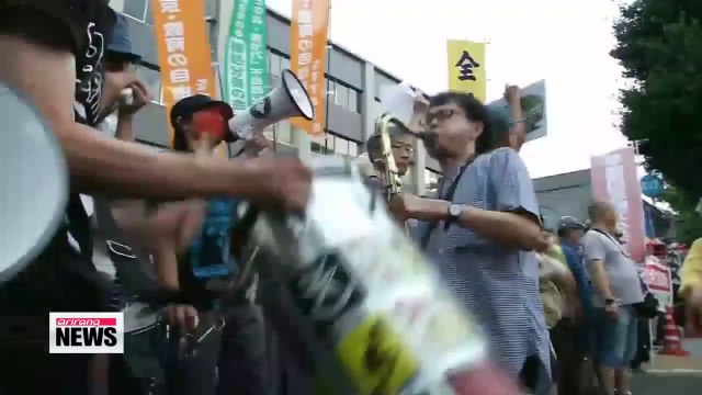 Japan ruling parties agree to plan to drop ban on collective self-defense lawmaker