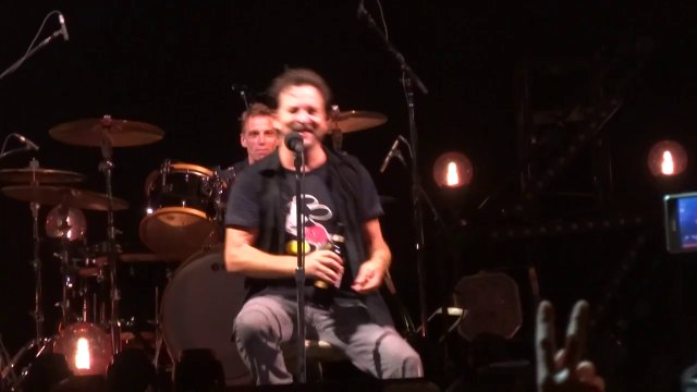Pearl Jam singer Eddie Vedder drinking wine from a fan shoe in stockholm festival