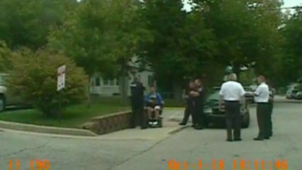 Shocking CCTV: Police officer pushes over man in wheelchair