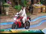 Dr.Amir Liaquat Hussain riding Honda Motorcycle in Ramazan Transmission -
