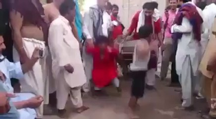 two little man dancing on dhol very cool.
