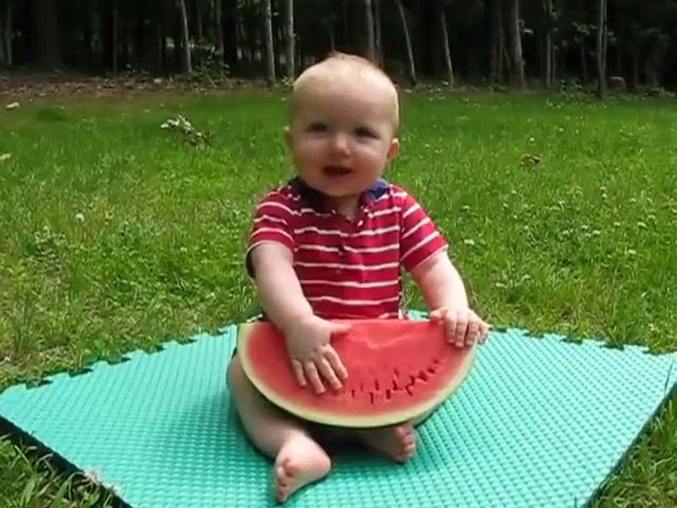 Little singer baby eating water melon