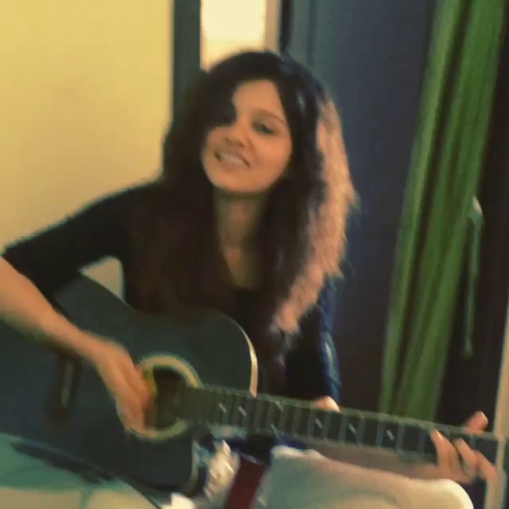 Rubi playing the guitar