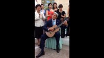 Kerry plays classical guitar in China