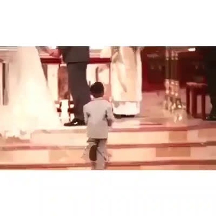 on wedding ceremony little kid doing some thing special.