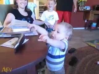 a cute child is attending the phone call