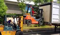 Forklift loading another forklift to load a truc! Crazy and weird but efficient!