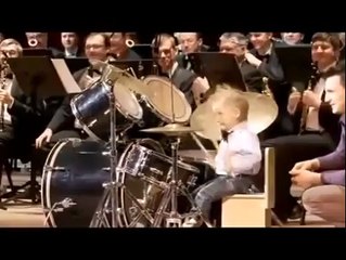 baby is plying  drum