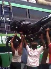 Man lifts Motorcycle With His Head