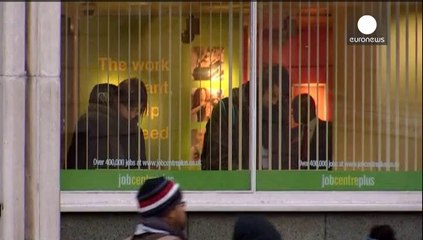 UK jobless falls, pay growth at record low