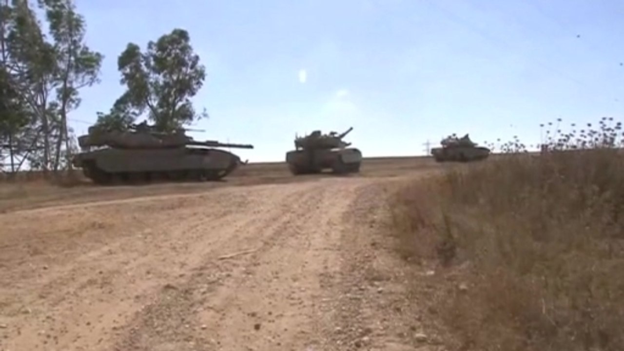 Israel launches ground offensive as Gazans bury their dead