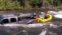 Rescuing a dog from the bed of a submerged truck