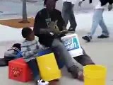 Homeless man and son play drums on buckets