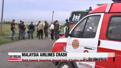 Dutch investigators demand MH17 bodies leave immediately