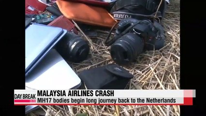 Victims of Malaysia plane downing begin long journey home