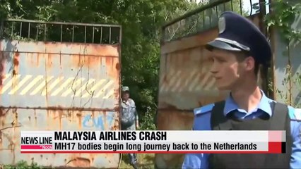 Victims of Malaysia plane downing begin long journey home