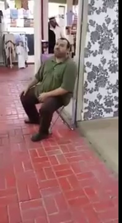 Arabic man calling a customer for Samosa