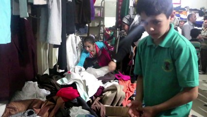 Syrie: les habitants d'Alep reçoivent des vêtements pour l'Aïd