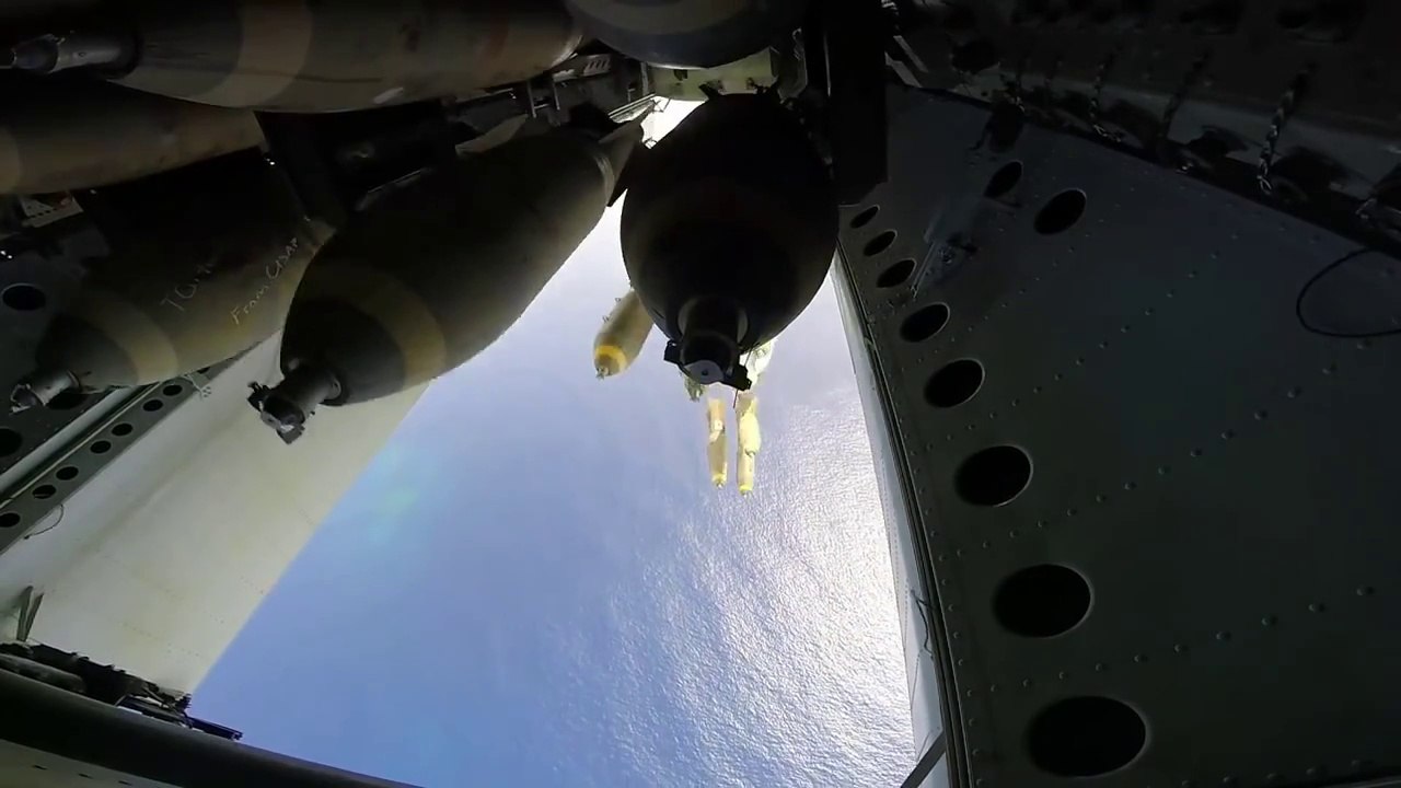 Military plane throwing 45 bombs on an island : impressive!